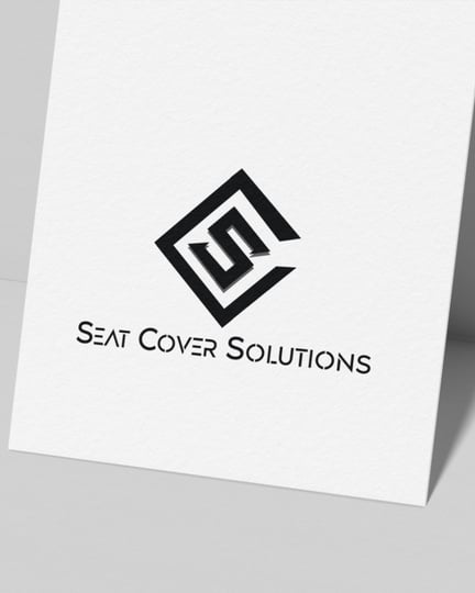 a business card with a black and white logo on it